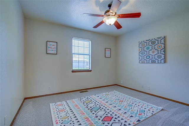 2109 Shamrock Dr, Edmond, OK 73003 - carpeted empty room featuring a ceiling fan and a textured ceiling