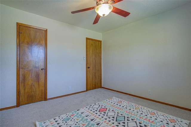 2109 Shamrock Dr, Edmond, OK 73003 - bedroom with light colored carpet and ceiling fan