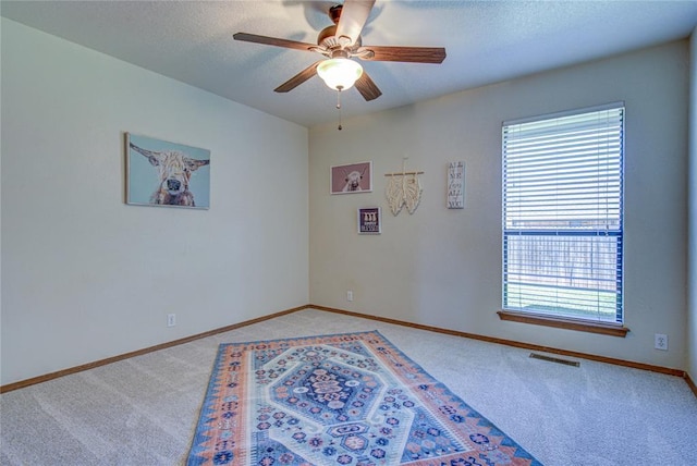 2109 Shamrock Dr, Edmond, OK 73003 - unfurnished room featuring carpet floors, ceiling fan, and a textured ceiling