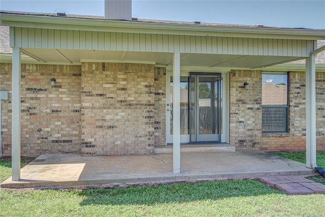 2109 Shamrock Dr, Edmond, OK 73003 - doorway to property with brick siding