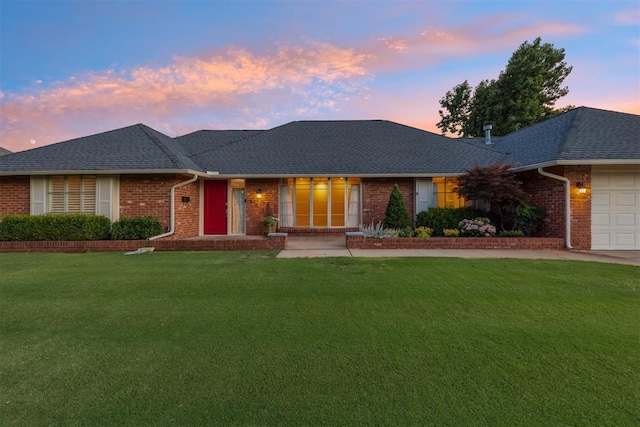 3000 Middlesex Dr, Oklahoma City, OK 73120 - ranch-style house featuring brick siding, a front yard, a garage, a shingled roof, and driveway