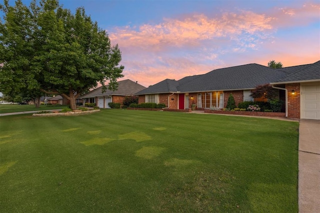 3000 Middlesex Dr, Oklahoma City, OK 73120 - ranch-style house with brick siding, a garage, and a front yard