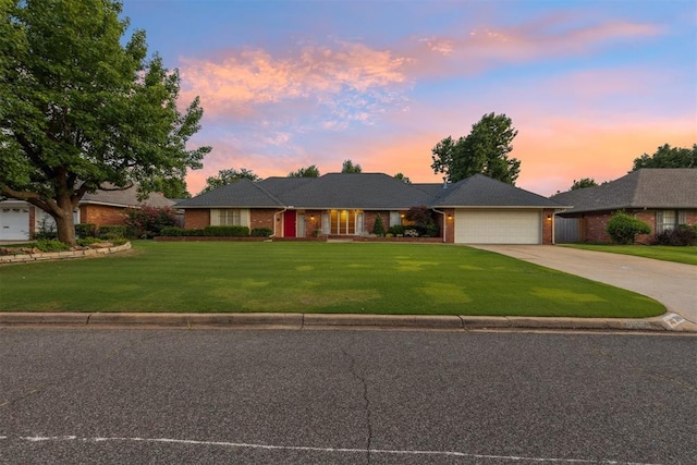 3000 Middlesex Dr, Oklahoma City, OK 73120 - single story home with an attached garage, driveway, a yard, and brick siding