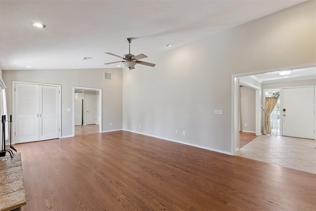3000 Middlesex Dr, Oklahoma City, OK 73120 - unfurnished living room with lofted ceiling, a ceiling fan, wood finished floors, and recessed lighting