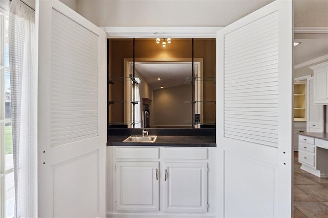 3000 Middlesex Dr, Oklahoma City, OK 73120 - bathroom featuring crown molding, tile patterned flooring, and vanity