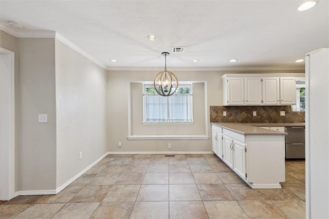 3000 Middlesex Dr, Oklahoma City, OK 73120 - kitchen with white cabinets, backsplash, a chandelier, crown molding, and decorative light fixtures