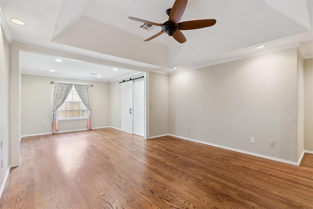 3000 Middlesex Dr, Oklahoma City, OK 73120 - empty room with ceiling fan, ornamental molding, a barn door, wood finished floors, and recessed lighting