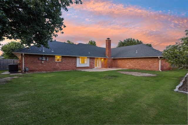 3000 Middlesex Dr, Oklahoma City, OK 73120 - rear view of house with a patio, a chimney, brick siding, and french doors