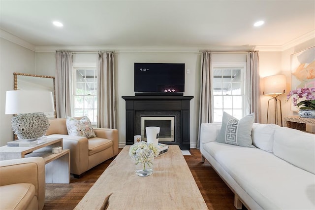 1005 NW 40th St, Oklahoma City, OK 73118 - living room featuring healthy amount of natural light, dark wood-style floors, ornamental molding, recessed lighting, and a fireplace with flush hearth