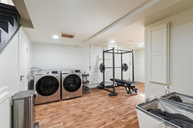 1005 NW 40th St, Oklahoma City, OK 73118 - laundry area with light wood-style flooring, washing machine and clothes dryer, and recessed lighting
