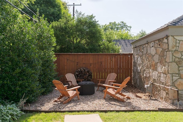 1005 NW 40th St, Oklahoma City, OK 73118 - view of patio / terrace with an outdoor fire pit