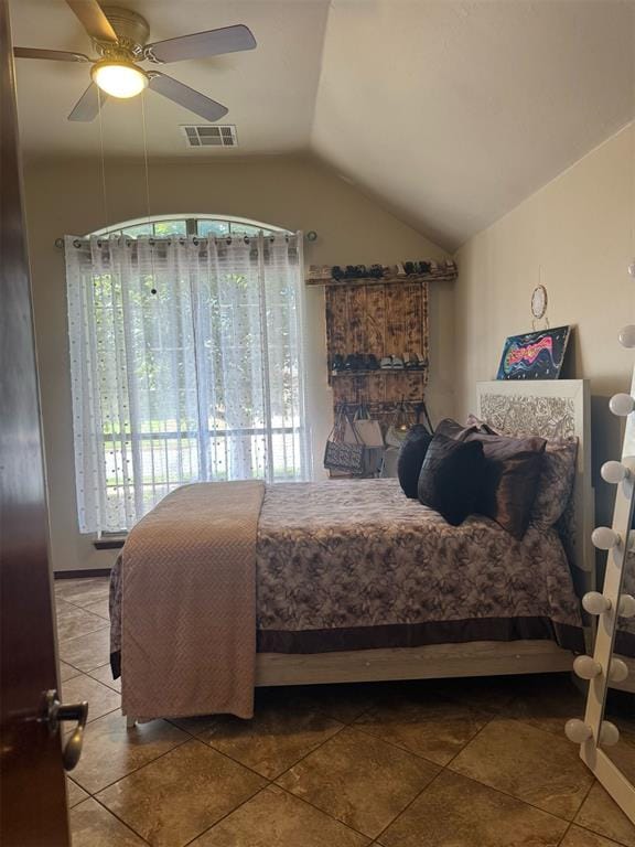 9209 SW 28th St, Oklahoma City, OK 73128 - bedroom featuring vaulted ceiling, tile patterned floors, multiple windows, and ceiling fan