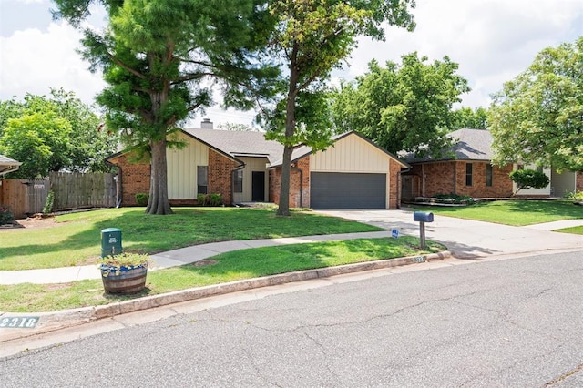 2322 Ripple Creek Ln, Edmond, OK 73012 - view of front of property featuring brick siding, a garage, concrete driveway, a chimney, and board and batten siding