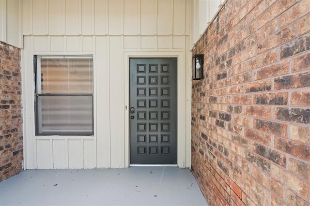2322 Ripple Creek Ln, Edmond, OK 73012 - view of exterior entry with board and batten siding