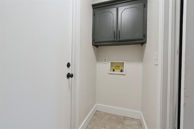 2322 Ripple Creek Ln, Edmond, OK 73012 - laundry room featuring hookup for a washing machine, cabinet space, and light tile patterned floors