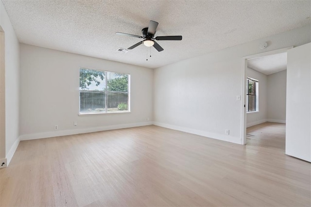 2322 Ripple Creek Ln, Edmond, OK 73012 - unfurnished room featuring light wood-type flooring, ceiling fan, a textured ceiling, and a smoke detector
