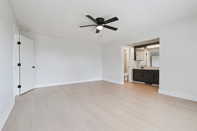 2322 Ripple Creek Ln, Edmond, OK 73012 - unfurnished room featuring light wood finished floors and a ceiling fan