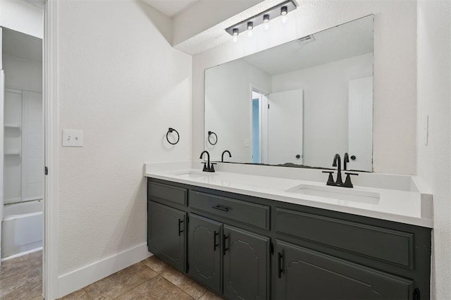 2322 Ripple Creek Ln, Edmond, OK 73012 - bathroom featuring double vanity and tile patterned flooring