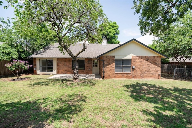 2322 Ripple Creek Ln, Edmond, OK 73012 - rear view of house with brick siding, a chimney, and a patio area