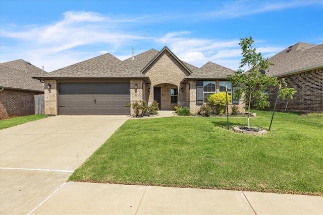 18608 Summer Grove Ave, Edmond, OK 73012 - french country inspired facade featuring brick siding, driveway, and a front yard