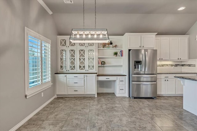 18608 Summer Grove Ave, Edmond, OK 73012 - kitchen featuring stainless steel refrigerator with ice dispenser, vaulted ceiling, open shelves, white cabinetry, and decorative backsplash