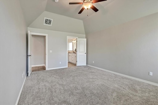 18608 Summer Grove Ave, Edmond, OK 73012 - unfurnished bedroom with carpet floors, vaulted ceiling, ensuite bathroom, and a ceiling fan