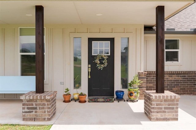 337030 E 1016th Rd, Meeker, OK 74855 - property entrance with board and batten siding, covered porch, and roof with shingles