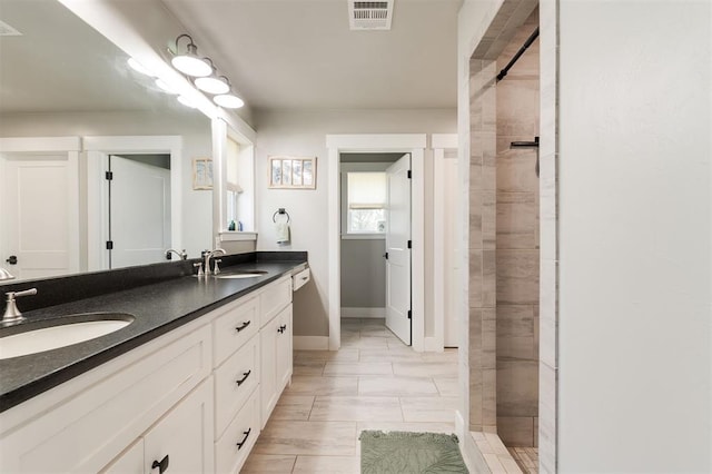337030 E 1016th Rd, Meeker, OK 74855 - bathroom featuring double vanity and a tile shower
