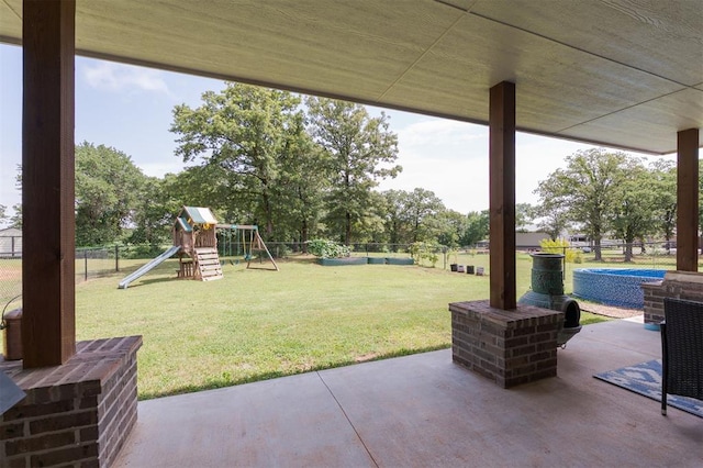 337030 E 1016th Rd, Meeker, OK 74855 - fenced backyard featuring a patio area and a playground