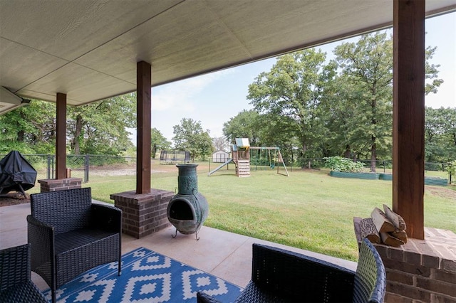 337030 E 1016th Rd, Meeker, OK 74855 - fenced backyard with a patio area, a playground, and view of wooded area