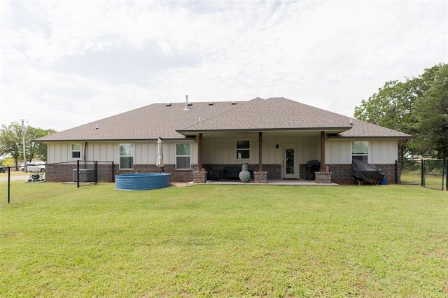 337030 E 1016th Rd, Meeker, OK 74855 - rear view of house featuring roof with shingles, brick siding, a fenced backyard, and a gate