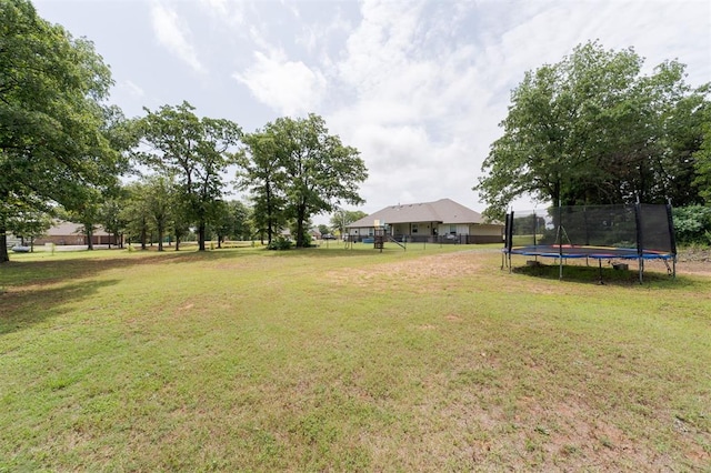 337030 E 1016th Rd, Meeker, OK 74855 - view of grassy yard featuring a trampoline