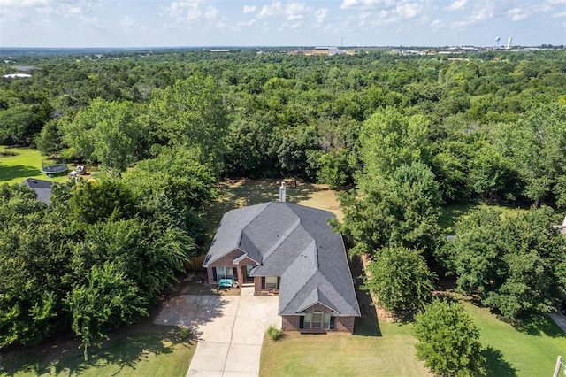 3751 Rock Dove Lndg, Edmond, OK 73034 - aerial view of property and surrounding area with a forest