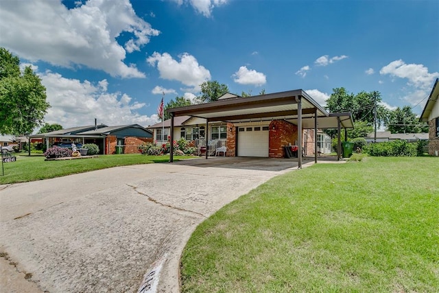 616 Kingston Dr, Yukon, OK 73099 - view of front of house with a front yard, driveway, brick siding, and a carport
