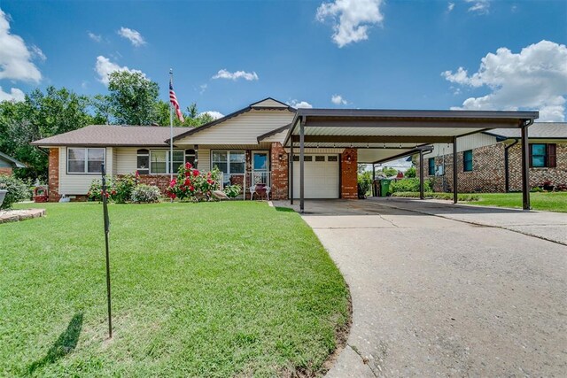 616 Kingston Dr, Yukon, OK 73099 - view of front facade featuring a garage, a front yard, a carport, and concrete driveway