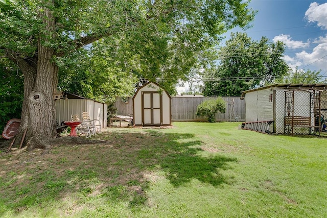616 Kingston Dr, Yukon, OK 73099 - fenced backyard with a storage unit
