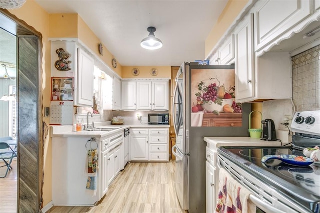 616 Kingston Dr, Yukon, OK 73099 - kitchen with stainless steel appliances, white cabinetry, light countertops, and decorative backsplash