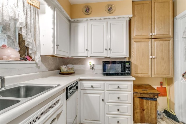 616 Kingston Dr, Yukon, OK 73099 - kitchen with black microwave, dishwasher, light countertops, and white cabinetry