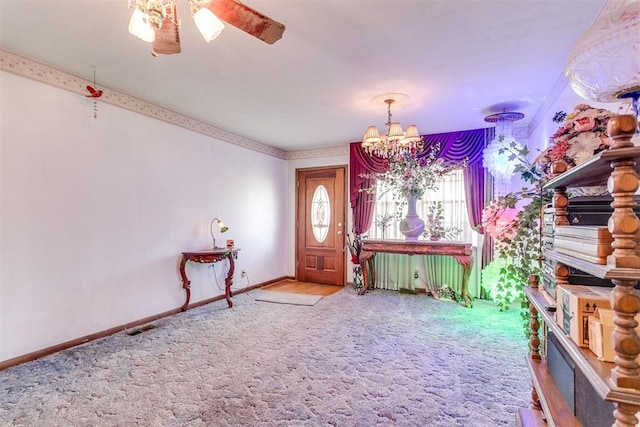616 Kingston Dr, Yukon, OK 73099 - foyer featuring a chandelier, carpet, and a ceiling fan