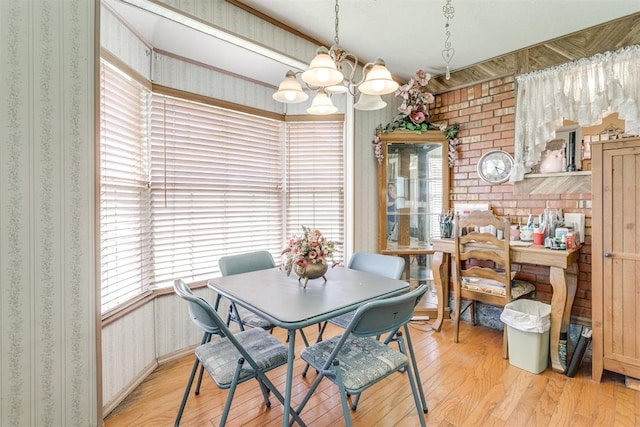 616 Kingston Dr, Yukon, OK 73099 - dining area with wallpapered walls, a chandelier, and light wood-style floors