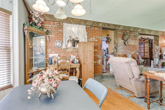 616 Kingston Dr, Yukon, OK 73099 - dining space with brick wall and wood finished floors