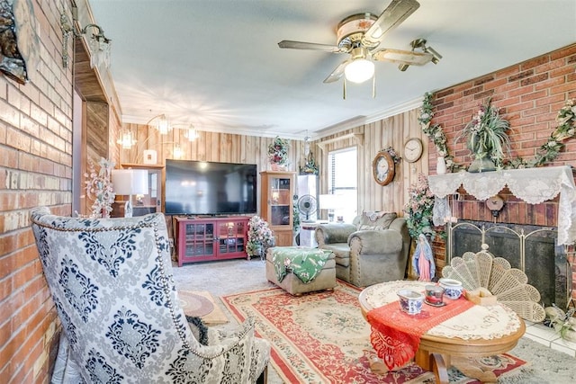 616 Kingston Dr, Yukon, OK 73099 - carpeted living room with ceiling fan, a brick fireplace, brick wall, and crown molding