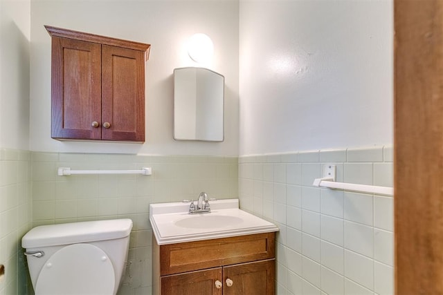616 Kingston Dr, Yukon, OK 73099 - half bath with vanity, wainscoting, and tile walls
