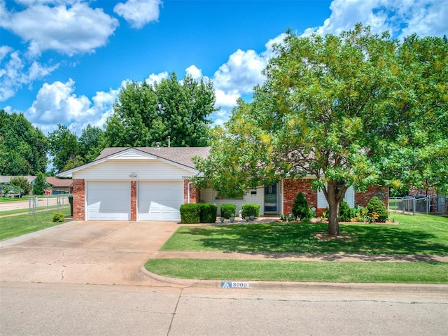 3000 Beverly Dr, Edmond, OK 73013 - view of front facade with brick siding, concrete driveway, and an attached garage