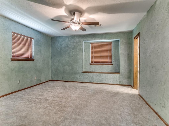 3000 Beverly Dr, Edmond, OK 73013 - carpeted empty room with ceiling fan and a textured ceiling