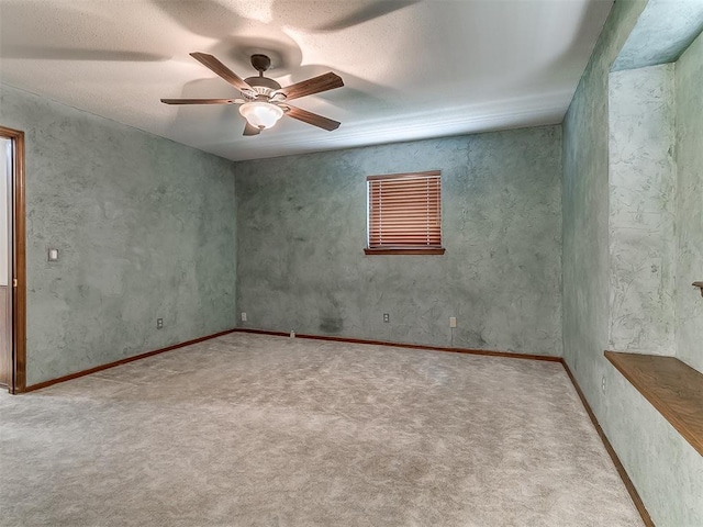 3000 Beverly Dr, Edmond, OK 73013 - carpeted spare room featuring a ceiling fan and a textured ceiling