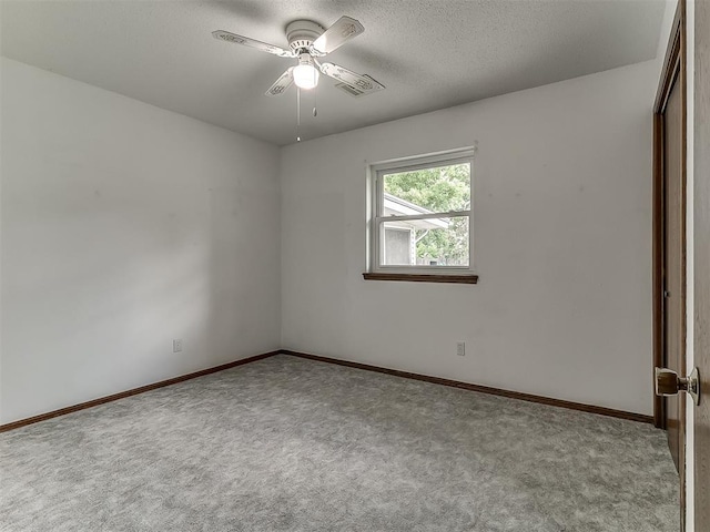 3000 Beverly Dr, Edmond, OK 73013 - unfurnished room with carpet, a ceiling fan, and a textured ceiling