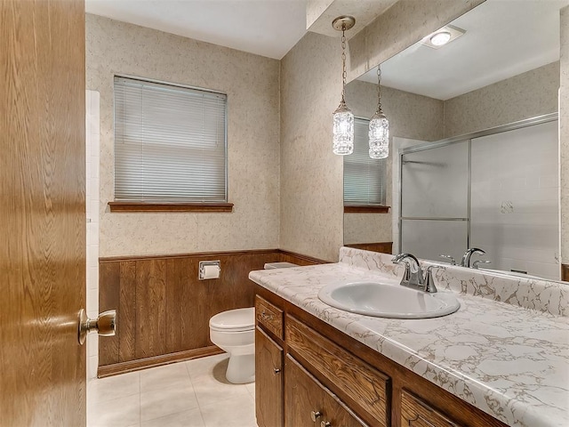 3000 Beverly Dr, Edmond, OK 73013 - bathroom featuring vanity, wainscoting, a shower with shower door, tile patterned floors, and wooden walls