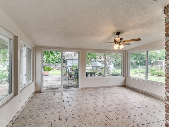 3000 Beverly Dr, Edmond, OK 73013 - unfurnished sunroom with tile patterned flooring and a textured ceiling