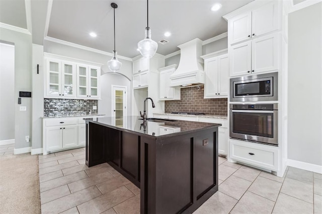 9041 NW 147th Ter, Yukon, OK 73099 - kitchen featuring appliances with stainless steel finishes, custom range hood, light tile patterned floors, tasteful backsplash, and ornamental molding